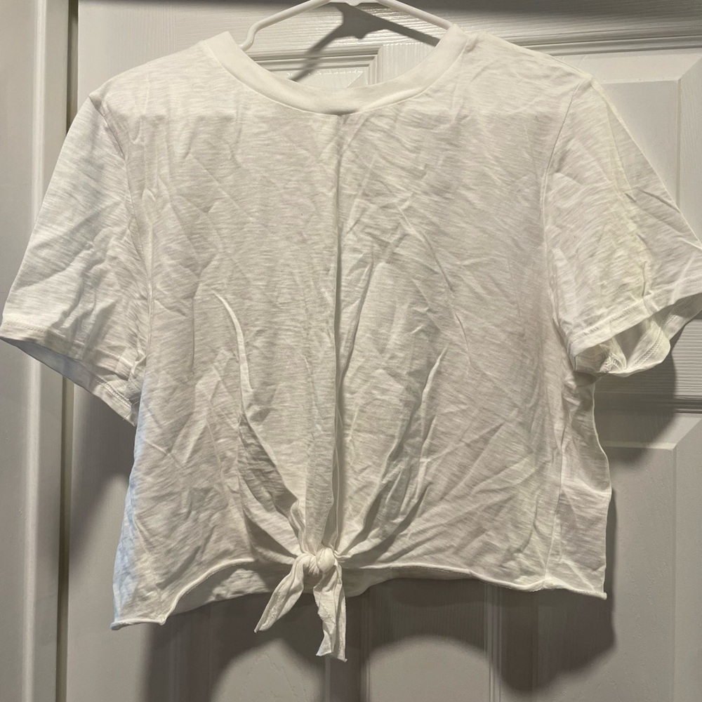 White crop top with tie in front.